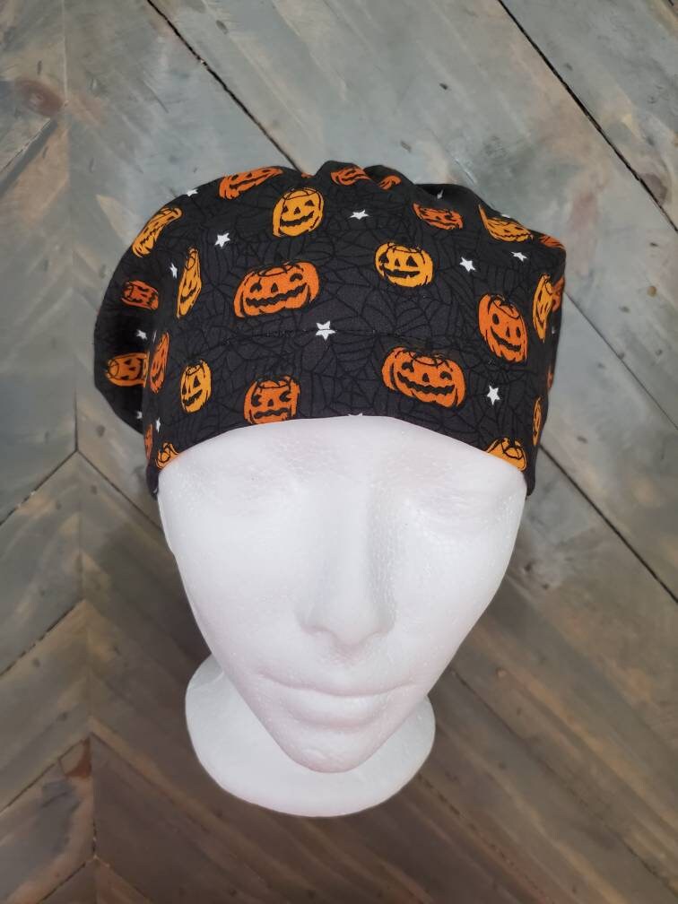 Glow in the dark stars and pumpkin bouffant/euro style surgical/scrub/dental hat by Carolinadreamsbyjen