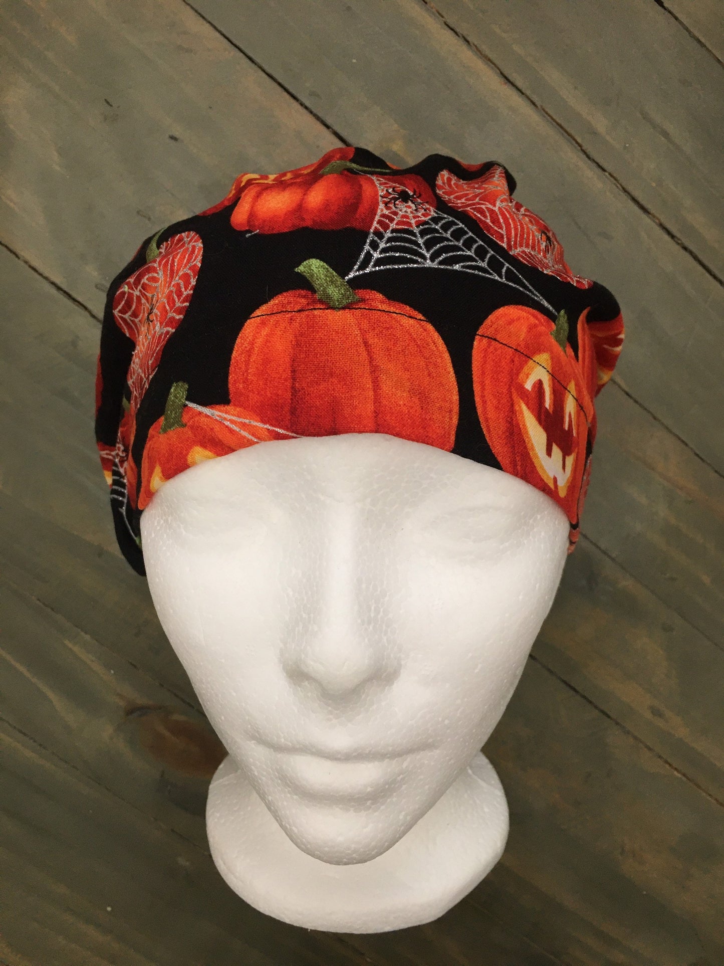 Jack o lanterns and spiderwebs bouffant/euro surgical hat ( has shimmer)