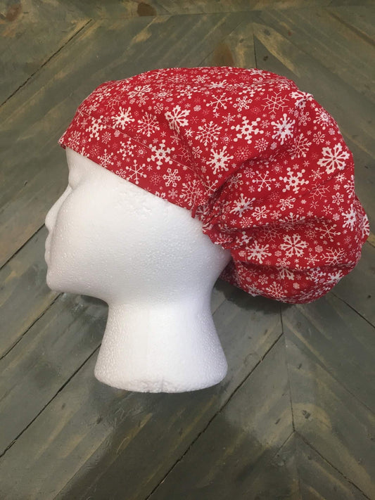 Snowflakes on red euro/bouffant style surgical hat.