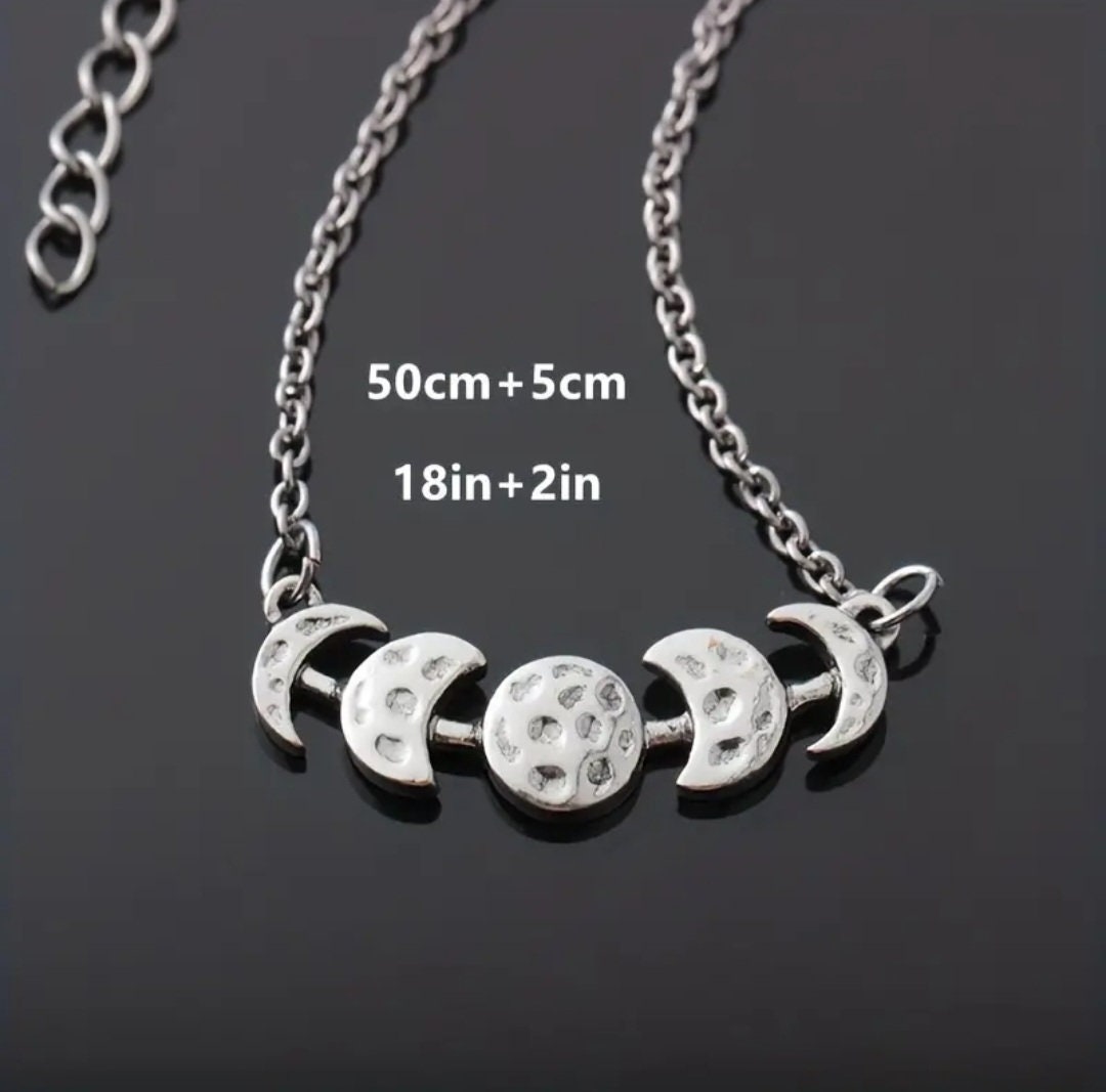 Phases of the moon hammered metal necklace on an 18 inch chain